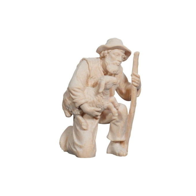 Shepherd kneeling with lamb in his arms for Nativity scene - Alpine